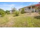 Expansive backyard with a covered porch offering a peaceful retreat and outdoor entertainment space at 2234 N Normandy Blvd, Deltona, FL 32725