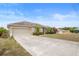 Well-maintained single-story home with a long driveway and attached two-car garage at 2234 N Normandy Blvd, Deltona, FL 32725