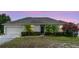 Charming single-story home featuring manicured landscaping and a welcoming front entrance at 2234 N Normandy Blvd, Deltona, FL 32725