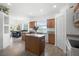 Bright kitchen with center island, stainless steel appliances, and a view of the adjacent dining area at 2234 N Normandy Blvd, Deltona, FL 32725