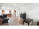 Airy living room featuring hardwood floors, white walls, and an open layout to the kitchen at 2234 N Normandy Blvd, Deltona, FL 32725
