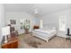 Light and airy bedroom with vaulted ceilings, plantation shutters, and neutral decor at 232 River Village Dr, Debary, FL 32713