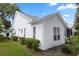 Home exterior showcasing well-maintained siding, lush landscaping, and a manicured lawn at 232 River Village Dr, Debary, FL 32713