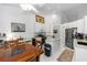 Kitchen with white cabinets, granite countertops, stainless steel appliances, and a breakfast bar for casual dining at 232 River Village Dr, Debary, FL 32713