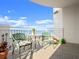 Balcony with cozy seating, overlooking the stunning beach and ocean, creating a tranquil and inviting outdoor space at 2403 S Atlantic Ave # 410, Daytona Beach, FL 32118
