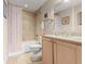 Cozy bathroom featuring a tiled shower with tub and a single vanity at 2403 S Atlantic Ave # 410, Daytona Beach, FL 32118