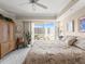 Bright bedroom with sliding doors to a balcony and beautiful decor at 2403 S Atlantic Ave # 410, Daytona Beach, FL 32118