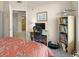 Comfortable bedroom featuring a home office with desk and shelving at 2403 S Atlantic Ave # 410, Daytona Beach, FL 32118