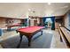Community game room with pool tables and shuffleboard at 2403 S Atlantic Ave # 410, Daytona Beach, FL 32118