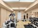 Weight training gym features universal weight machine, dumbbells, and tile floors at 2403 S Atlantic Ave # 410, Daytona Beach, FL 32118
