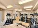 Bright gym with tile floors features cardio machines and ceiling fans at 2403 S Atlantic Ave # 410, Daytona Beach, FL 32118
