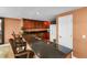 Spacious kitchen with dark cabinets and granite countertops, complete with bar seating at 2403 S Atlantic Ave # 410, Daytona Beach, FL 32118