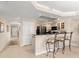 A kitchen featuring granite countertops, a breakfast bar, and modern appliances offers the height of convenience at 2403 S Atlantic Ave # 410, Daytona Beach, FL 32118