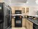 A modern kitchen featuring granite countertops and stainless steel appliances offers space and style at 2403 S Atlantic Ave # 410, Daytona Beach, FL 32118