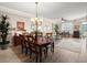 A bright and spacious living room with a chandelier and hardwood floors offers a welcoming space at 2403 S Atlantic Ave # 410, Daytona Beach, FL 32118