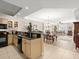 An open-concept kitchen, dining, and living area offers great space for entertaining guests at 2403 S Atlantic Ave # 410, Daytona Beach, FL 32118