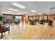 Spacious lobby with tables and chairs, plants, and a column at 2403 S Atlantic Ave # 410, Daytona Beach, FL 32118