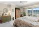 Spacious main bedroom with sliding glass doors opening to a balcony at 2403 S Atlantic Ave # 410, Daytona Beach, FL 32118