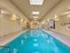 Indoor lap pool featuring clear blue water and multiple skylights at 2403 S Atlantic Ave # 410, Daytona Beach, FL 32118