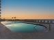 Pool with beach view at sunset at 2403 S Atlantic Ave # 410, Daytona Beach, FL 32118