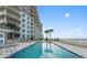 Exterior pool deck with an ocean view and lounge chairs at 2403 S Atlantic Ave # 410, Daytona Beach, FL 32118