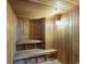 A wooden sauna with wooden benches and paneling features recessed lighting at 2403 S Atlantic Ave # 410, Daytona Beach, FL 32118