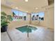Indoor spa with a small pool and large windows at 2403 S Atlantic Ave # 410, Daytona Beach, FL 32118