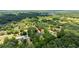 An aerial view of this home nestled within a lush, green neighborhood at 2455 Whooping Crane Dr, De Leon Springs, FL 32130