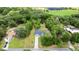 Aerial view of property showing boundaries surrounded by lush greenery and a beautiful treeline at 2455 Whooping Crane Dr, De Leon Springs, FL 32130