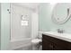 A stylish bathroom with modern fixtures and a sleek tub-shower combination at 2455 Whooping Crane Dr, De Leon Springs, FL 32130