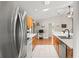 A spacious kitchen with stainless steel appliances and wooden cabinets, perfect for cooking and entertaining at 2455 Whooping Crane Dr, De Leon Springs, FL 32130