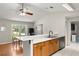 Eat-in kitchen with a fireplace that transitions into the cozy living room at 2455 Whooping Crane Dr, De Leon Springs, FL 32130