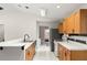 Galley style kitchen with tile flooring and views to living space and bedroom at 2455 Whooping Crane Dr, De Leon Springs, FL 32130