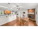 Bright, open living space featuring a brick fireplace and eat-in kitchen at 2455 Whooping Crane Dr, De Leon Springs, FL 32130