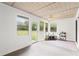 Bright sunroom featuring multiple windows, natural light, and outdoor access at 2455 Whooping Crane Dr, De Leon Springs, FL 32130