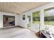 Enclosed sunroom with tiled ceiling, fan, and backyard views at 2455 Whooping Crane Dr, De Leon Springs, FL 32130