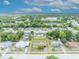 An aerial view showcases the property's location in a quiet, tree-lined neighborhood at 2468 Kimberly Dr, Deltona, FL 32738
