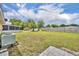 Spacious backyard featuring a well-maintained lawn, tall privacy fence, and a storage shed at 2468 Kimberly Dr, Deltona, FL 32738