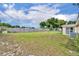Vast backyard surrounded by a wooden fence, providing privacy and ample space for outdoor activities at 2468 Kimberly Dr, Deltona, FL 32738