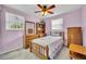 Comfortable bedroom with natural light and wooden furniture at 2468 Kimberly Dr, Deltona, FL 32738