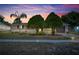 Charming single-story home featuring a well-maintained lawn and mature trees at sunset at 2468 Kimberly Dr, Deltona, FL 32738