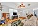 Bright living room featuring hardwood floors, comfortable seating, and plenty of natural light at 2468 Kimberly Dr, Deltona, FL 32738