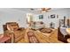 Cozy living room featuring hardwood floors, comfortable seating, and natural light at 2468 Kimberly Dr, Deltona, FL 32738