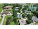 Nice community and home featuring a pond, landscaping, unique architecture, and a pool at 2480 S Glen Eagles Dr, Deland, FL 32724