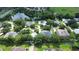 Aerial view of a wonderful community near a pond with lush trees, landscaping, pool, and homes at 2480 S Glen Eagles Dr, Deland, FL 32724