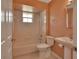 The bathroom features a tub/shower combination and a pedestal sink at 2480 S Glen Eagles Dr, Deland, FL 32724