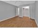 This bedroom includes a closet and wood-look floors at 2480 S Glen Eagles Dr, Deland, FL 32724