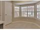 Cozy breakfast nook with bright windows and tile flooring next to the kitchen at 2480 S Glen Eagles Dr, Deland, FL 32724
