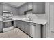 Well-equipped kitchen with stainless steel appliances and gray cabinets at 2480 S Glen Eagles Dr, Deland, FL 32724