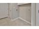 Neutral laundry room features tile flooring and washer/dryer hookups at 2480 S Glen Eagles Dr, Deland, FL 32724